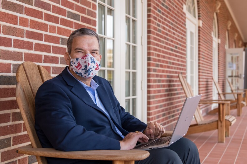 Dean Glen Krutz masked with laptop.jpg